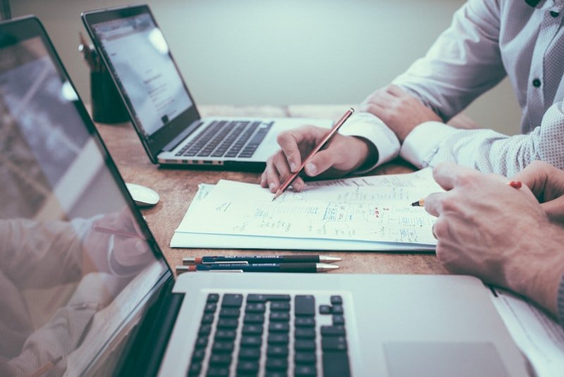 Business owner reviewing software development cost estimates and budget
