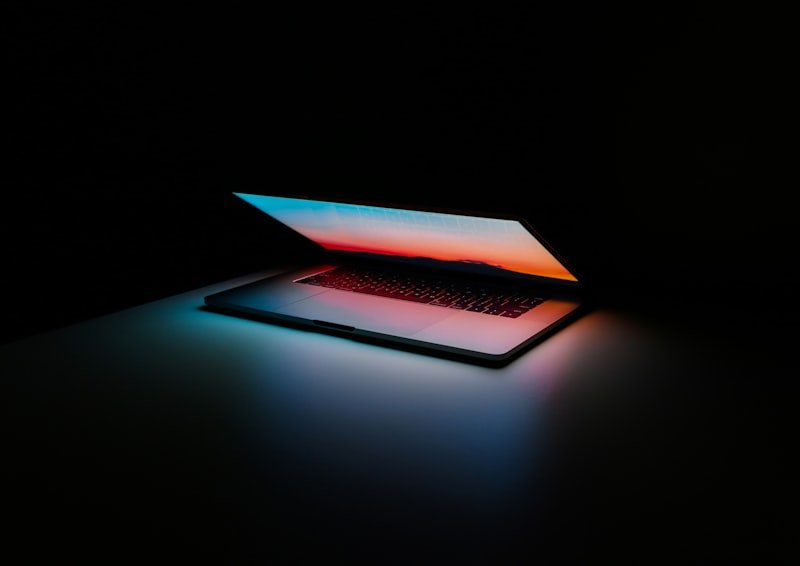 Small business owner using custom software on laptop